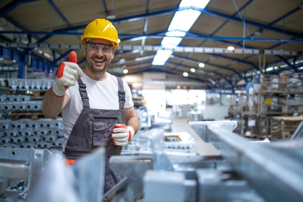 portrait-factory-worker-protective-equipment-holding-thumbs-up-production-hall (1)